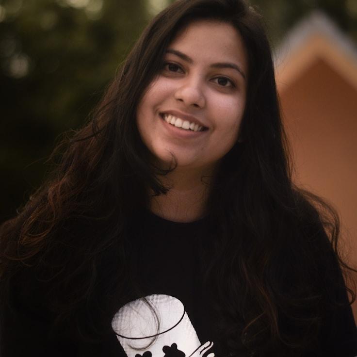 Alex Carter, Lead Design Curator at Bright Desert Oasis, reviewing corporate floral arrangements